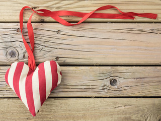 textile heart with red ribbon