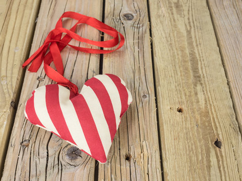 textile heart with red ribbon
