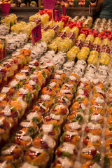rows of fresh fruit pots laid out on a market stall