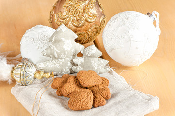 Fototapeta na wymiar Preparing to christmas. Glass toys and ginger brown cookies.