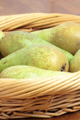 Few pears in a basket.