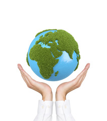 hands holding earth with grass africa