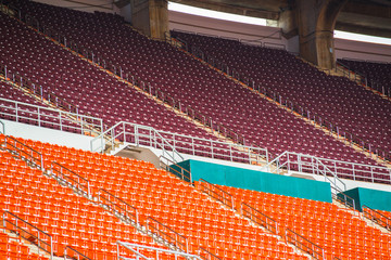 stadium, red seats on stadium steps bleacher