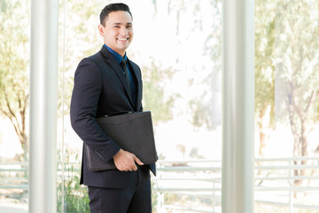 Fototapeta premium Happy man with a briefcase