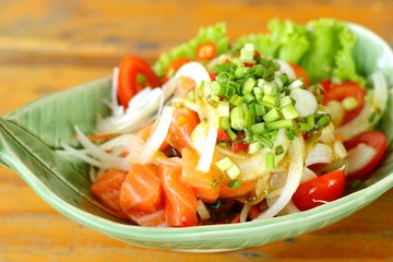 Fresh salmon salad with spices - Japanese food.