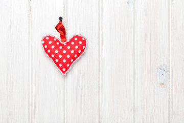 Valentines day toy heart over wooden table background