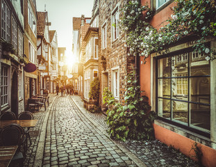 Fototapeta na wymiar Old town in Europe at sunset with retro vintage filter effect
