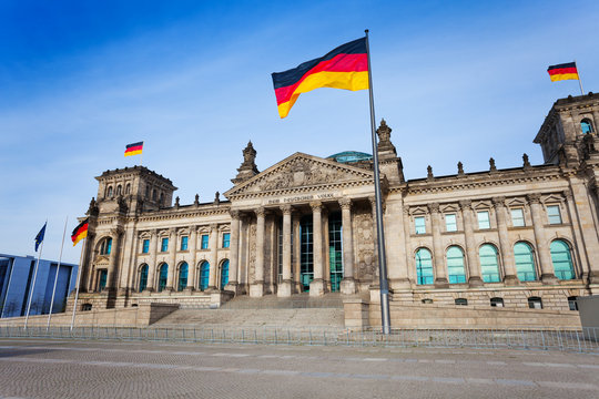Reichstag facade view with German flags, Berlin