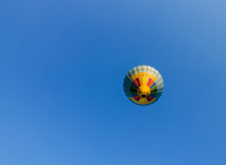 Hot air balloon on blue sky background