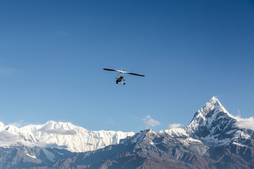 Fototapeta na wymiar Ultra light flight over the Annapurna in Nepal
