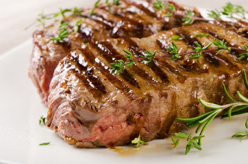 Beef steak on a  white plate