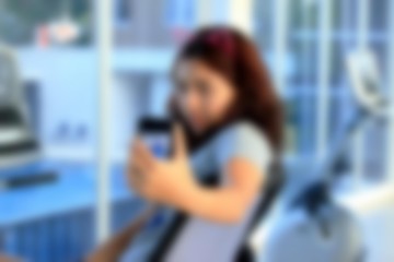 Blurred woman exercising smart phone.