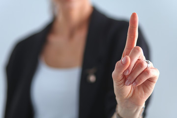 Woman touching an imaginary screen with her finger - isolated