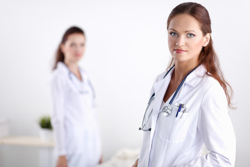 Fototapeta premium Two young woman doctor , standing in hospital