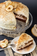 layered chocolate and cream cake with apples