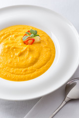 pumpkin creme soup in white plate
