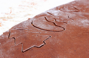 Shape of cookie cutters and dough for gingerbread