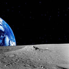 Fototapeta na wymiar Earth-rise behind the Moons horizon.