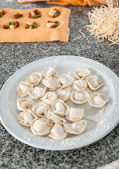 Various Pastas On Countertop In Kitchen