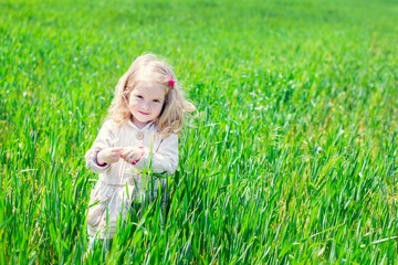 Beautiful happy little girl smiling outdoors