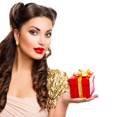 Beauty girl with gift box in her hand. Retro woman portrait