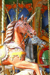 Fototapeta na wymiar Braunes Einhorn auf einem Karusell