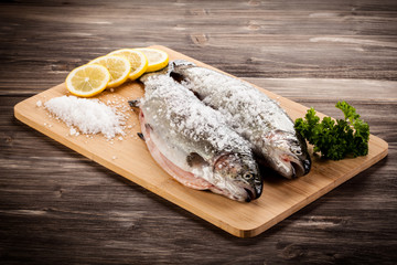 Fresh raw trouts on cutting board