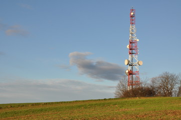 Telecommunication tower on the field