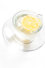 tea in cup with lemon isolated on white background
