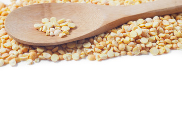 Buckwheat isolated with a wooden spoon on white background