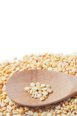 Buckwheat isolated with a wooden spoon on white background