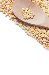 Buckwheat isolated with a wooden spoon on white background