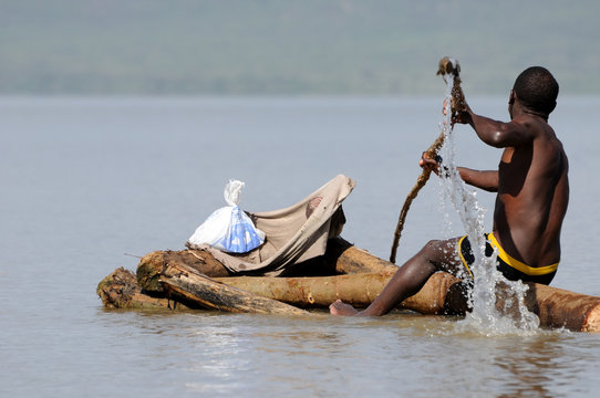 Poor men paddling in Ethiopia
