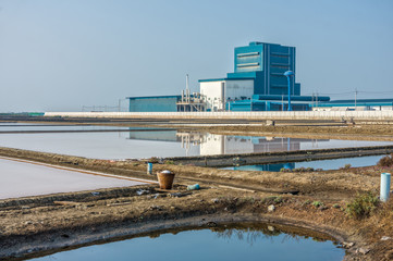 A factory near by salt evaporation pond at countryside in Thaila