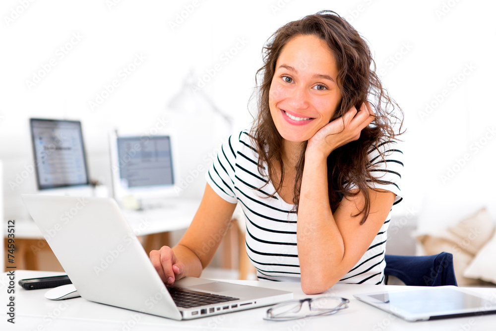 Wall mural young attractive student woman working at home