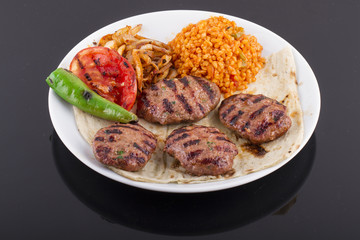 Meatballs or Burger with salad and garnish