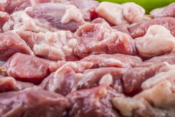 Raw skewer and vegetables on plate