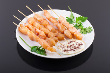 Raw Chicken Skewers On Plate