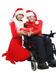 Obraz na płótnie Canvas Disabled Santa Claus and Santa Girl