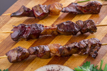 Grilled Liver Kebab on a Wood Plate