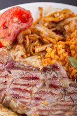 Grilled Steaks and Vegetables On a Plate with Plexiglass