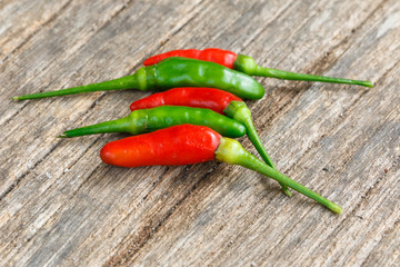 Hot green and red chili or green and red chilli pepper  on old w