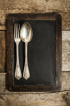 Blackboard with spoon and fork