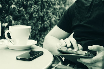 close up man's hands using tablet