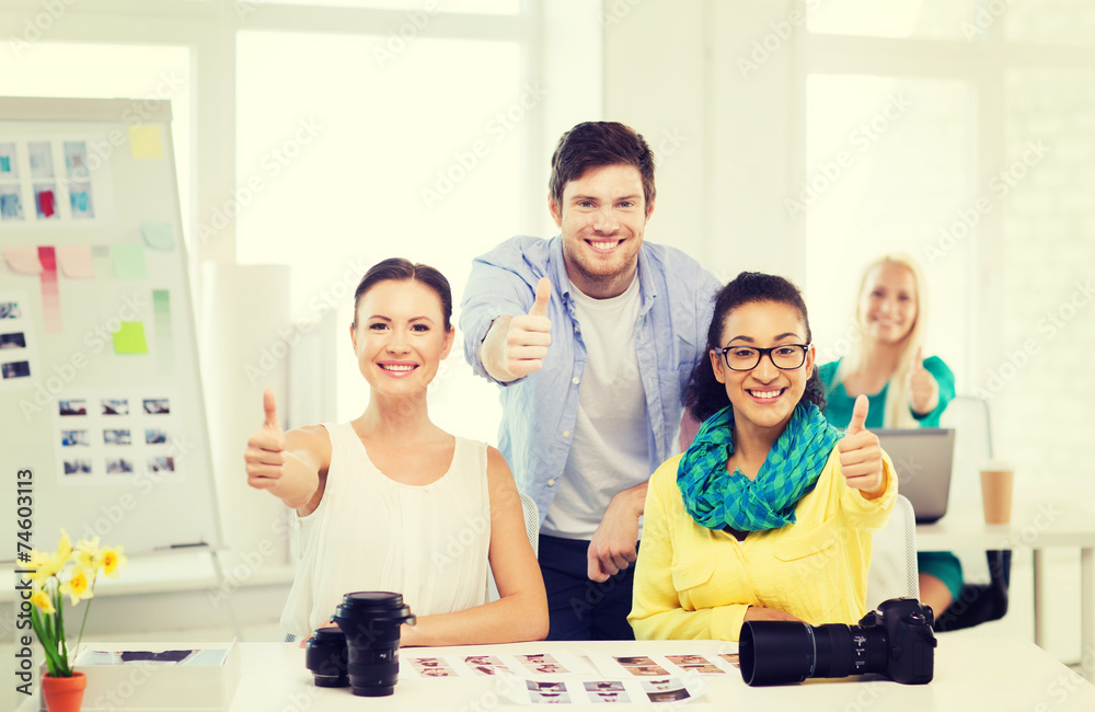 Canvas Prints smiling team with photocamera in office