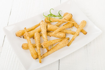 Parsnips - Honey roasted parsnips on a white background