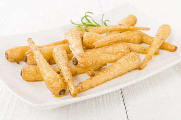 Parsnips - Honey roasted parsnips on a white background