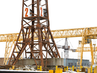 Fototapeta na wymiar tower and bridge cranes in metal product warehouse