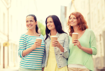 smiling teenage girls with on street