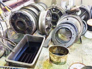 gears of disassembled engine in workshop